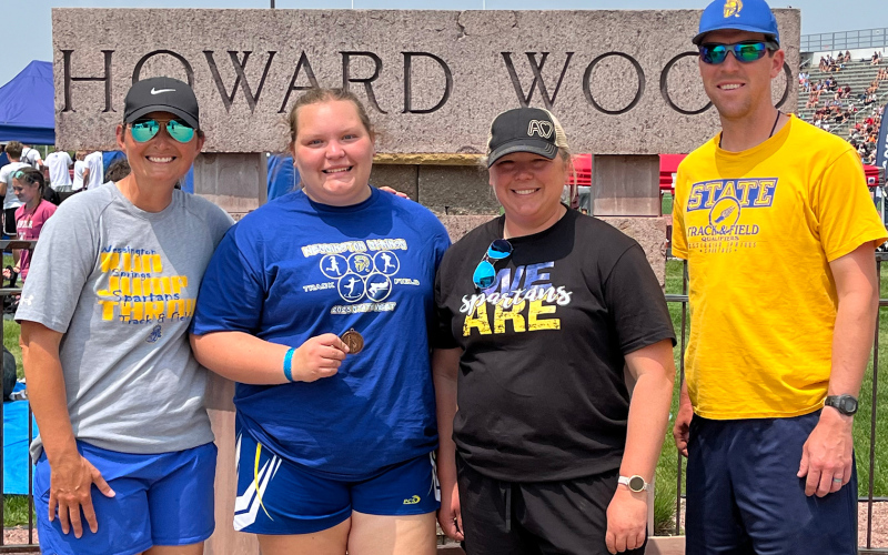 Head Track and Field Coach Becky Krueger, Anna Arhart, 4th place finisher in shot put, Assistant Coaches Joy Arhart and Drew Kraft.