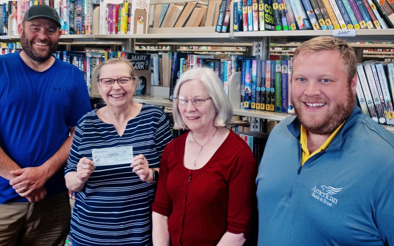 SUBMITTED Show left to right are: Member of Frontier Lodge #87 of Wessington Springs Eric Schroeder, Carnegie Library Librarian Rhonda Behrens, Assistant Librarian Gretchen Burnison, Member of Frontier Lodge #87 of Wessington Springs Blake Willman.