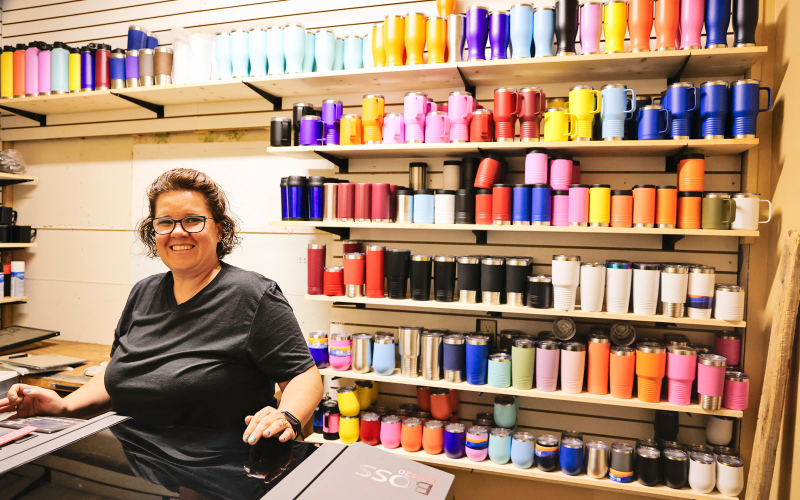 After a life-altering health crisis forced her to close the floral side of Baker’s Design in Wessington Springs earlier this year, Laura Baker is now embracing a fresh start — a “reboot” of her Main Street business. She’s excited about renewed focus on the giftware, embroidery, screen printing, and newly added laser engraving side of the business.