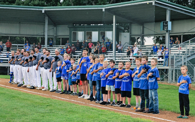 Little League Springs baseball players joined the Springs Owls on the big field for lineup and the national anthem during their end-of-season celebration.
