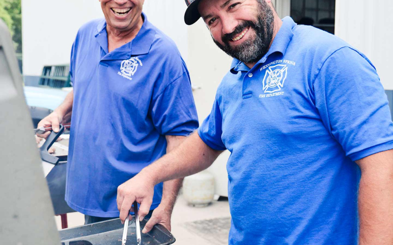 Serving up hundreds of burgers and brats kept firemen such as grillers Kim Schultz and Jarrod Bultsma busy at the barbecue.
