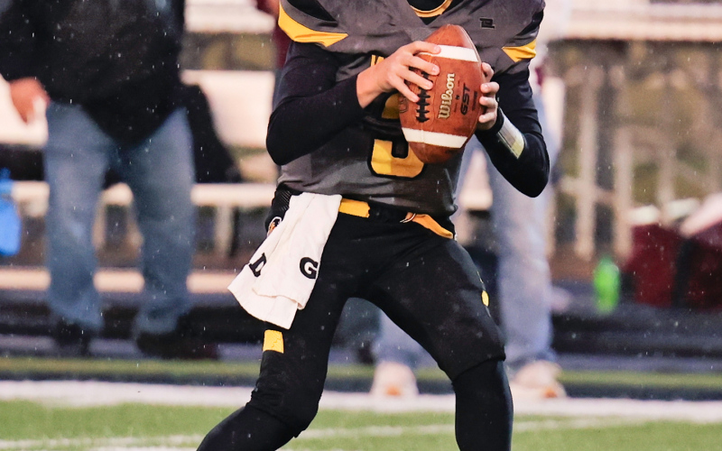 Ty Boomsma is pictured during a soggy football homecoming match up vs. Platte-Geddes Friday.
