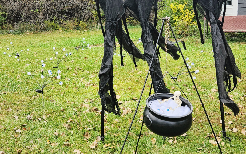 Tabitha Willman and daughter Aliza have a few witches concocting a hearty Halloween brew in their front yard, along with some ghoulish grave markers and ghosts.