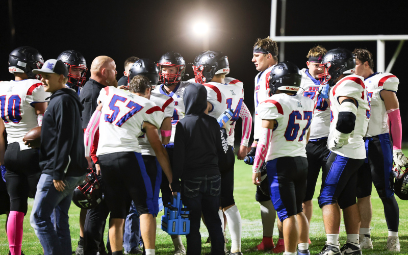 Bucks in the huddle with Coach Schmitz