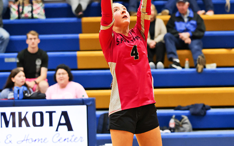 Logan Mohling reaches up to set the ball.
