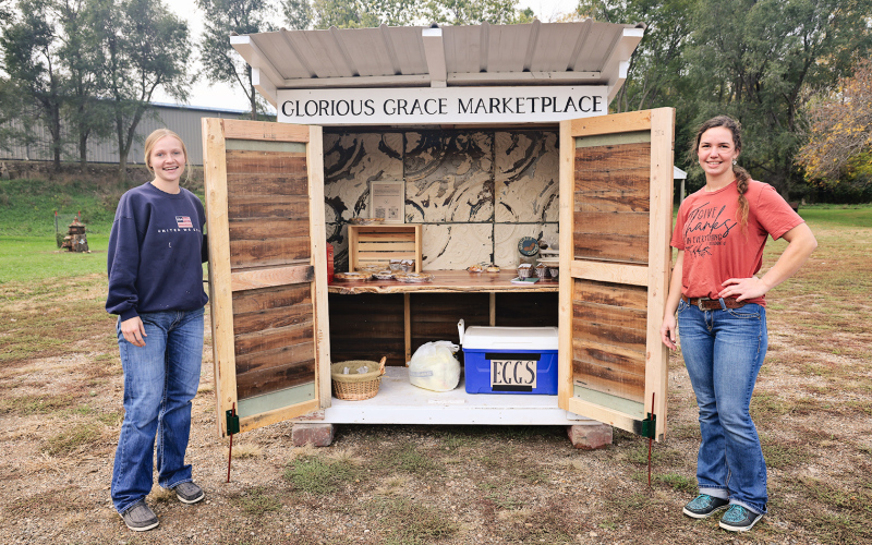 Sisters Ruthe Lindvall (left) and Cheri Lopez, both of Wessington Springs, opened their self-service bakery stand, Glorious Grace Marketplace, on October 17. KRISTI HINE / TRUE DAKOTAN