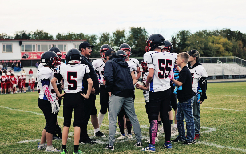 Coaches Armondo Rodriguez and Trey Weber in the huddle with the Bucks. PHOTO COURTESY KATIE JONES PHOTOGRAPHY