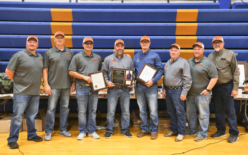 Darwin Weeldreyer is joined by fellow Wessington Springs Pheasants Forever Chapter #835 members as he proudly displays his Hall of Fame plaque and the official proclamation declaring October 17, 2025, as Darwin Weeldreyer Day in South Dakota. Shown left to right are: Chapter President Paul Sheldon, Chapter Members Mike Krueger, Brian Bell, Brady Younie, Darwin Weeldreyer, Steve Winter, Blake Willman and Tom Riddle.