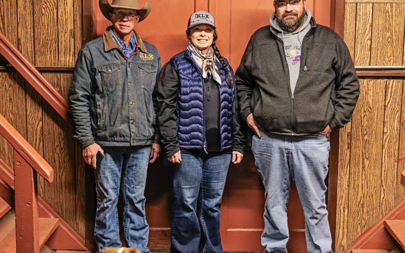 Chad Heezen, Christy Christensen Wade Christensen and Mini Australian Shepherd Rusty at Kimball Livestock Exchange on sale day Tuesday, October 28, 2025.