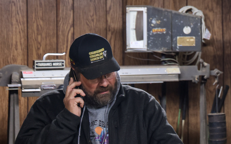 Wade Christensen busy on the phone just before the sale starts.