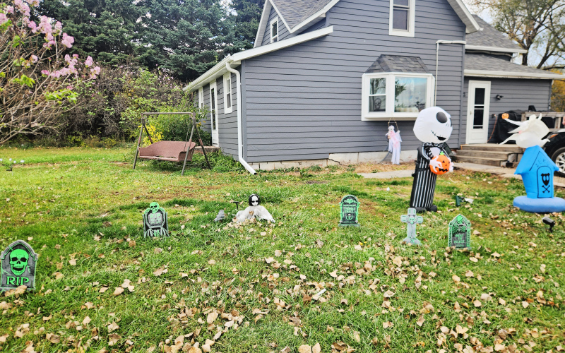 Tabitha Willman and daughter Aliza have a few witches concocting a hearty Halloween brew in their front yard, along with some ghoulish grave markers and ghosts.