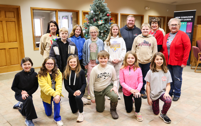 Front row, left to right: Blair Murphy, Raven Richardson, Carlayna Waters, Kolt Messmer, Hannah Wenzel and Paislei Bell. Back row, left to right: Fourth grade teacher Jen Roduner, Cooper Holt, Emme Havlik, Hayden Bultsma, Alice Heumiller, and Will Arhart. Bank employees Blake Willman, Susan Tebay and Connie Larson.