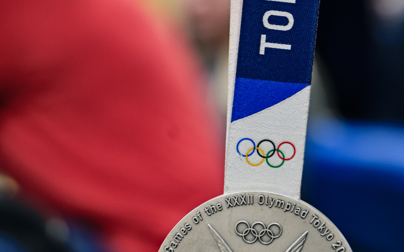 Nilsen’s silver medal from the Tokyo Olympics was among the medals and rings the athletes shared with students during the visit.