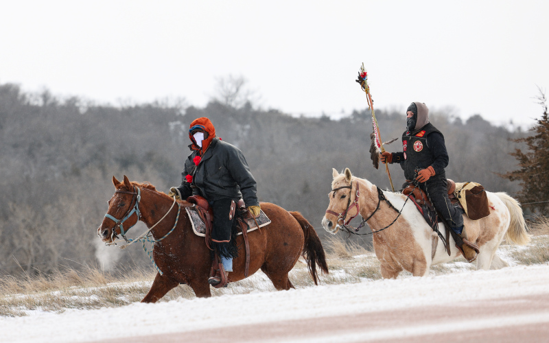 Riders participating in the Makatoh Reconciliation and Healing Horse Ride enter Wessington Springs from South Dakota Highway 34 on Friday, marking a long-standing stop in the community’s role as a host along the sacred winter journey. (KRISTI HINE / TRUE DAKOTAN)
