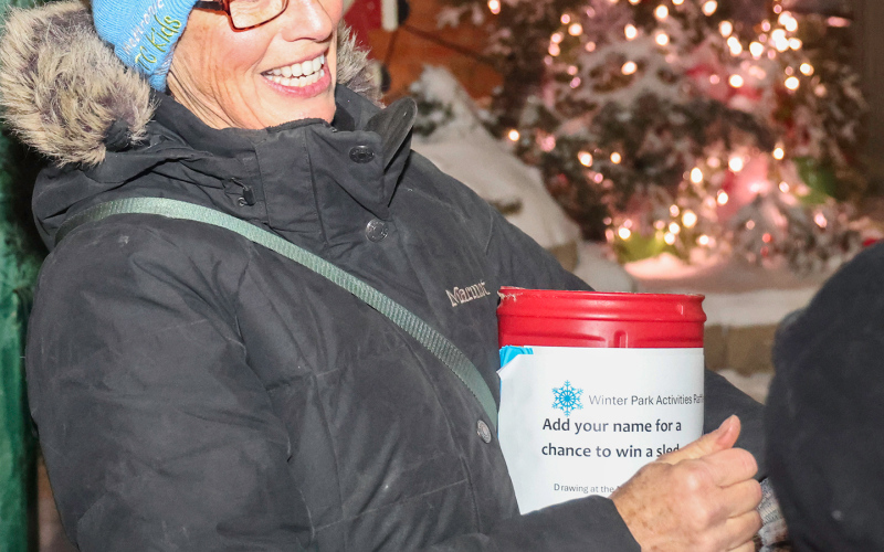 Gwyneth Fastnacht, event coordinator for Magic in the Park, drew names for two free sleds after the Christmas tree lighting. That event officially kicks off Sunday, Dec. 7, with an additional sled to be given away.