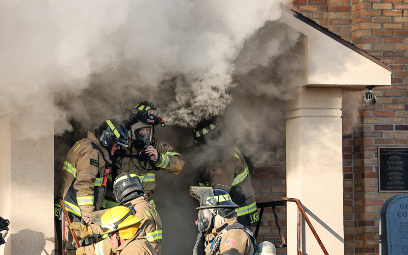 Smoke billows from the front entrance of St. Joseph Catholic Church in Wessington Springs Friday morning as firefighters work at the scene after a fire was reported shortly after 9 a.m. (KRISTI HINE / TRUE DAKOTAN)