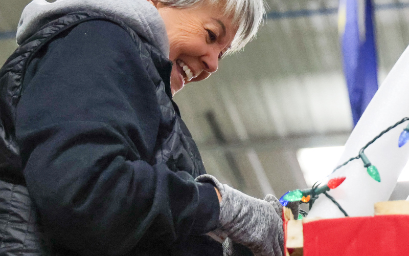 Jane Fritzsche works on light detail while helping decorate the Wessington Book Club's holiday float.