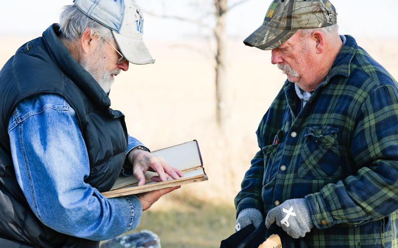 Tom Dean and Darrell Deneke review a beautifully handwritten cemetery record book from the 1880s.
