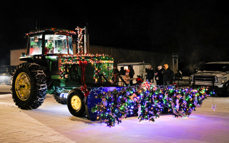 A tractor decked out in holiday lights rolls down Main Street as part of the Wessington Parade of Lights.