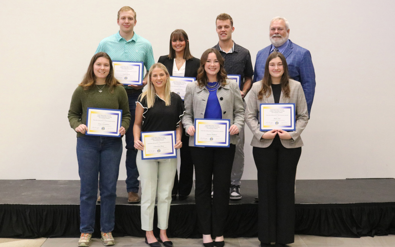 Cheyenne Burg (front row, second from left) was recently named the winner of the William M. Griffith and Byrne S. Griffith Endowment scholarship at the SDSU College of Agriculture, Food and Environmental Sciences Scholarship and Recognition Banquet. She is pictured with SD Corn Endowed Dean of the college, Joe Cassady and other endowment winners. (PHOTO COURTESY SDSU)