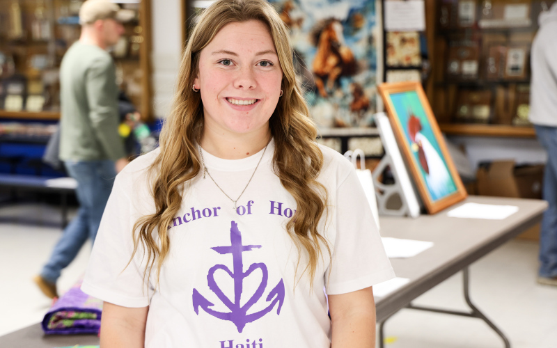 Wessington Springs High School senior Ella Fagerhaug stands in the elementary school lunchroom where she hosted a community fundraiser as her senior project, raising money to support children and families through Anchor of Hope Haiti.