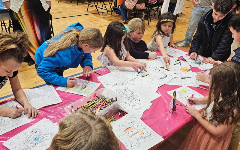 Children take part in one of the many interactive activities during Bright Nights, Big Smiles, a family fun night hosted by Wessington Springs High School students.
