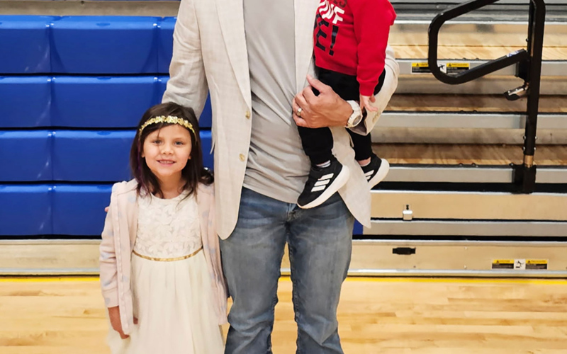 Joey Mitchell poses with his daughter Moxee and son Bex while attending Bright Nights, Big Smiles at the Wessington Springs Recreation Center.