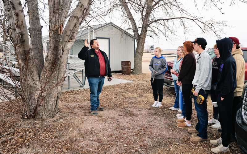 WSHS Vo-Ag teacher Brady Duxbury explains the maple tree tapping process to WSHS ag students.