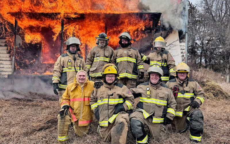 Area firefighters take part in a live burn training during Firefighter I and II certification hosted by Wessington Springs Volunteer Fire Department (WSVFD). Pictured are (back, from left) WSVFD fireman Erik Kurth, Kolby Sinkie of Pukwana Volunteer Fire Department , WSVFD firemen Aryan Schooler and Jonathan Jooste; (front, from left) instructor Brian Baldwin, WSVFD firemen Tyler Fastnacht, Blake Willman and Coy Fastnacht. (PHOTO COURTESY WSVFD)