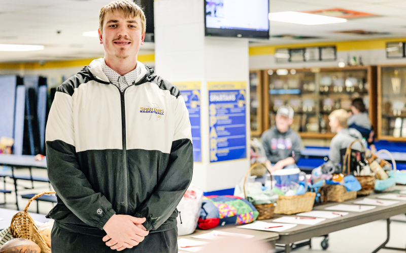 Grady Gran is pictured in the Wessington Springs Elementary School lunchroom, where he hosted a free-will donation meal and silent auction to benefit the WWSSC football team as part of his Senior Experience project. (KRISTI HINE / TRUE DAKOTAN)