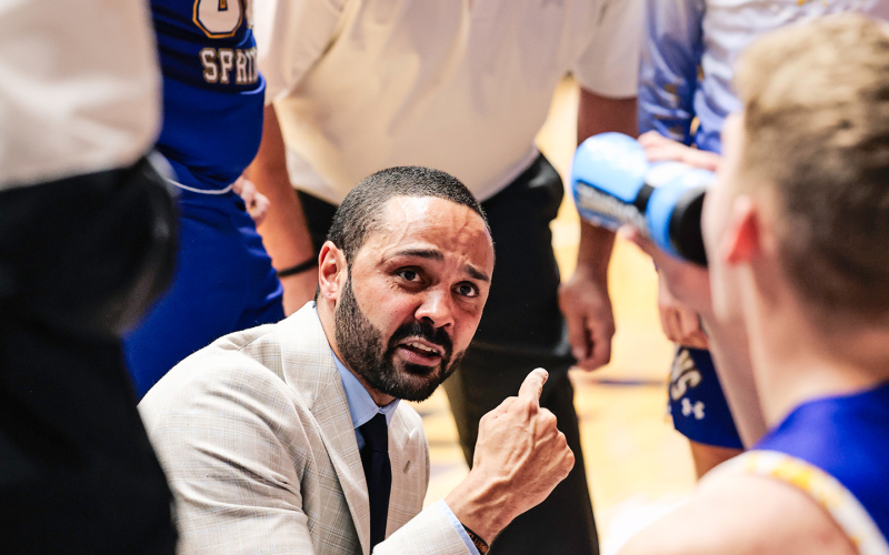 Spartans gather around head coach Joey Mitchell as he delivers instructions during a timeout in the Region 2B semifinal against Castlewood. View over 100 photos from the game at www.truedakotan.com. (KRISTI HINE / TRUE DAKOTAN)