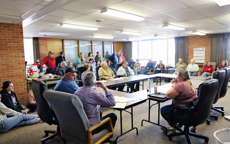 Residents packed Wessington Springs City Hall on Monday, March 9, 2026, many standing or seated on the floor, as the city’s zoning board held a public hearing on a request to rezone land for a proposed cryptocurrency mining facility. After hearing comments and questions from the public, the board voted 3-2 to recommend denying the rezoning request. (KRISTI HINE / TRUE DAKOTAN)