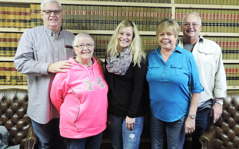 True Dakotan founders Duke and Karen Wenzel (left) and Penny and Craig Wenzel (right) stand with Kristi Hine after signing papers transferring ownership of the newspaper on Jan. 30, 2015. Hine officially took over as publisher on March 1, 2015. Eleven years later, the commitment to local, independent journalism and the community support that sustains it remain as important as ever. (TRUE DAKOTAN FILE PHOTO)