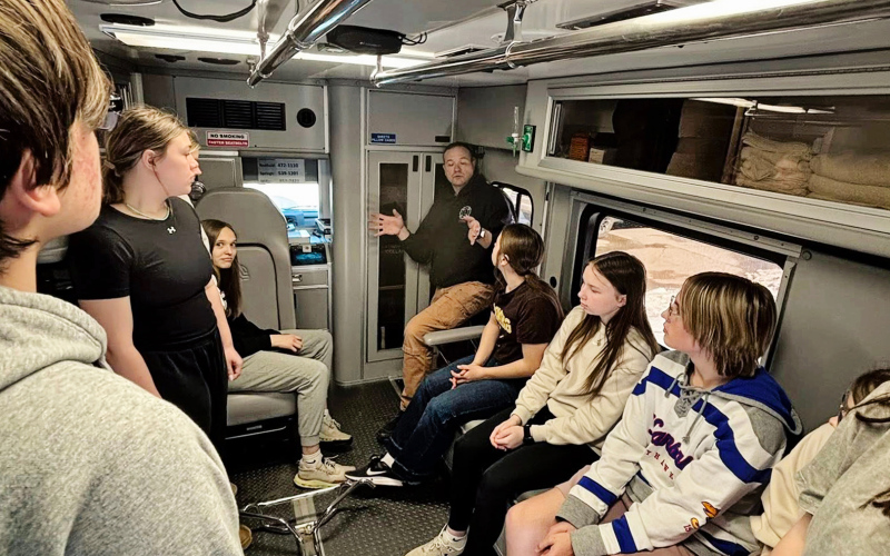 At top, students practice hands-only CPR under the guidance of an instructor during Medic Camp at Wolsey-Wessington School, a handson program designed to introduce youth to careers in emergency medical services and rural health care. Above, Students get an upclose lookinsideanambulance during Medic Camp at Wolsey-Wessington School, where participants rotated through interactive stations to learn about emergency response and explore careers in rural health care. (PHOTOS COURTESY JULIE BOOMSMA)