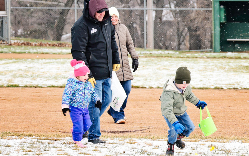 Nyla Schimke, joined by Uncle Michael and Aunt Jennifer Feister, learns quickly that speed matters during the egg hunt as one she had her eye on is scooped up by Kase Van Dyke.
