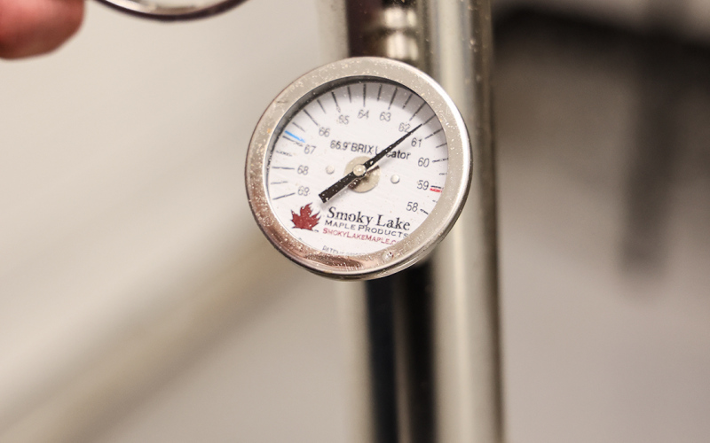 Using a Murphy cup and hydrometer, students worked toward the ideal 66.9% sugar concentration required for finished syrup.