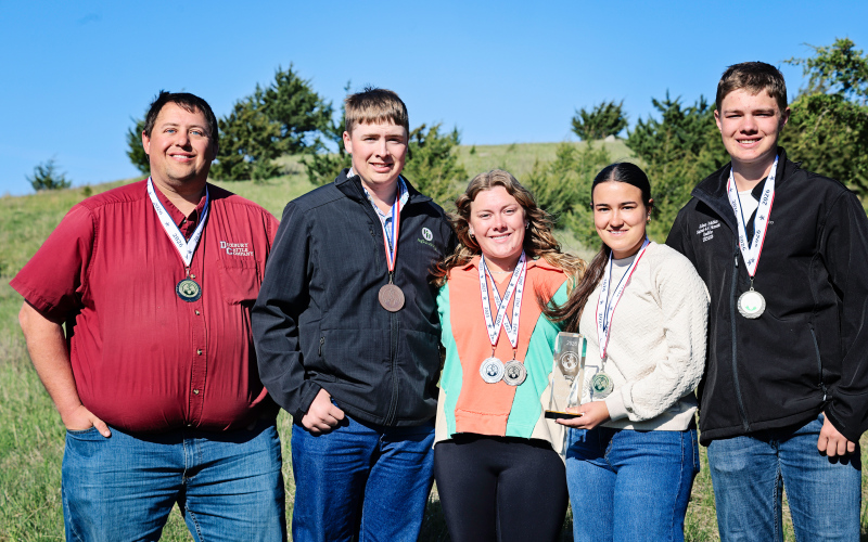 National champions returned home with hardware in hand as Vo-Ag Advisor Brady Duxbury joined Max Klein, Ella Fagerhaug, Remie Roduner and Kohen Mebius at the land judging practice site west of Wessington Springs following the 2026 National Land and Range Judging Contest in Oklahoma City. The Wessington Springs FFA homesite team captured the national championship title, while Klein was also named national individual champion. (KRISTI HINE / TRUE DAKOTAN)