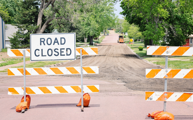 A road closure sign blocks traffic at the intersection of First Street and Barrett Avenue in Wessington Springs as crews continue work on the city’s water main replacement project. City officials are asking residents to respect all road closures and allow extra travel time while construction is underway. (KRISTI HINE / TRUE DAKOTAN)