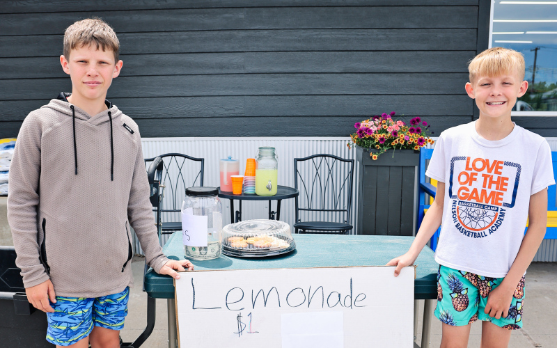 Ethan Heumiller and Holden Schelske, with a little help from Bosten Jensen (not pictured), served up one of Wessington Springs’ first lemonade stands of the summer outside Springs Food Market last week.