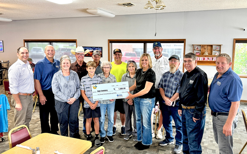 Hope Cemetery accepts a $1,500 grant for fence improvements. Pictured from left to right: Central Electric General Manager Designate Ryan Mueller, General Manager Ken Schlimgen, Melissa Schimke, Dale Schimke, Parker Couch, Larry Powell, Norma Powell, Herman Eilers, Susan Olson, Operation Round-Up Trustee Amber Kolousek, Rick Couch, Ron Thompson, Central Electric Director Mark Reindl and Central Electric Director Merl Bechen.