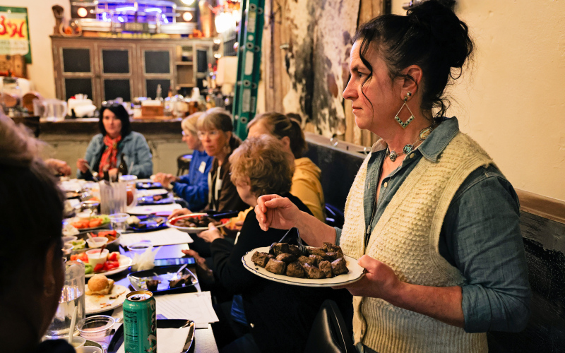 Heather Larson of Sweet Grass serves beef samples during a cooking demonstration that allowed Women’s Ag Network attendees to compare how different cuts and cooking methods affect tenderness and flavor. (KRISTI HINE / TRUE DAKOTAN)