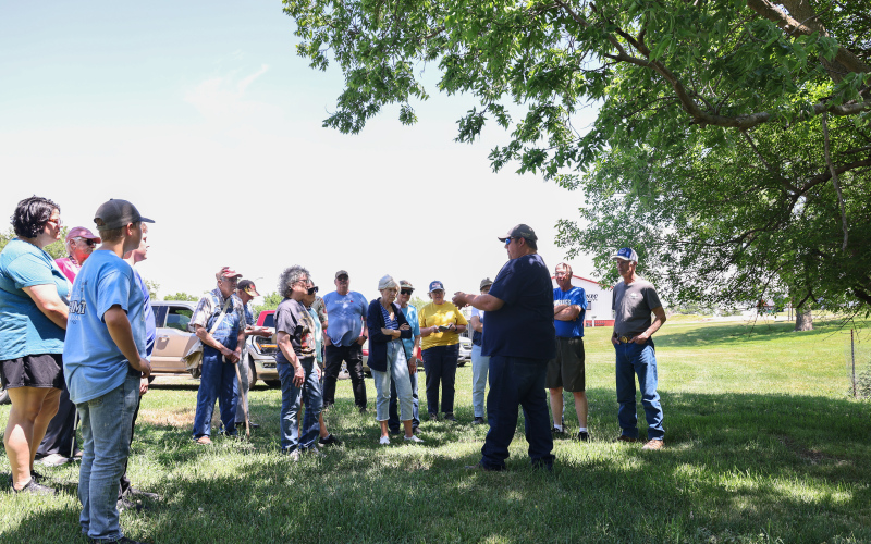 Wessington Springs High School Vo-Ag instructor Brady Duxbury points out identifying characteristics of trees during “A Walk in the Park” on May 31 in Wessington Springs City Park.