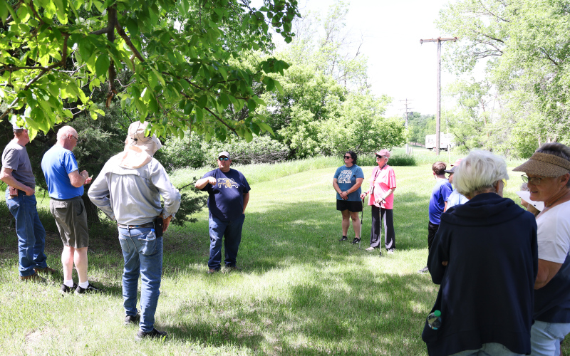Wessington Springs High School Vo-Ag instructor Brady Duxbury points out identifying characteristics of trees during “A Walk in the Park” on May 31 in Wessington Springs City Park.