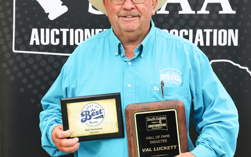 Wessington Springs auctioneer Val Luckett displays awards recognizing two recent career milestones. Luckett was inducted into the South Dakota Auctioneers Association Hall of Fame and was also nominated for Best Auctioneer in the Mitchell Republic’s 2026 Best of the Best contest.