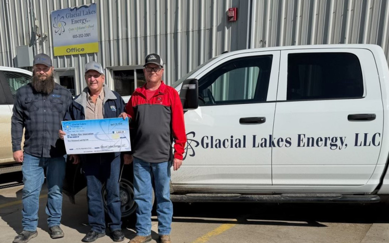 Steve Birkholtz, GLE Board of Director presents funds to Wolsey Fire Association to purchase much needed equipment which includes harnesses, rope and rigging gear needed in grain bin rescues or other falls.