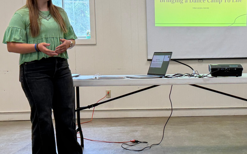 Mercedes Jones earned a purple ribbon for her illustrated talk, “Step by Step: Bringing a Dance Camp to Life,” sharing the planning and work involved in creating a dance camp.