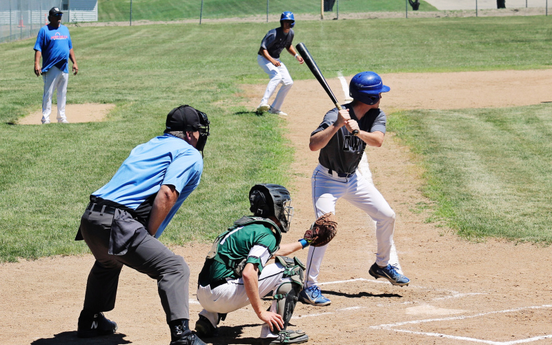 Dylan Schimke bats with Brock Krueger at third base during Sunday’s doubleheader against Chamberlain. Schimke drove in five runs across the two games as the Owls swept the Mallards. (PHOTOS BY CRAIG WENZEL FOR THE TRUE DAKOTAN)