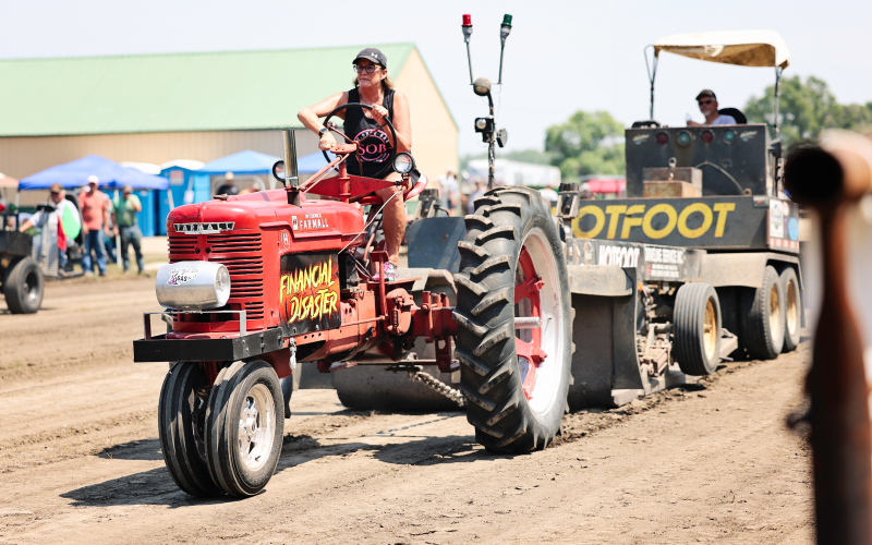Despite triple-digit temperatures, the Alpena community turned out Saturday to support the Alpena Volunteer Fire Department’s annual tractor pull and enjoy a full day of activities. A tractor powers down the track during the day’s competition.