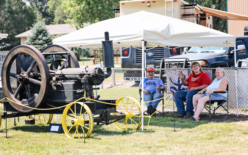 Harvey Davis, Nelson Terkildsen and Mae Davis pose with their 1910 Dempster 18-horsepower stationary gas engine during the Alpena Community Foundation Car Show.