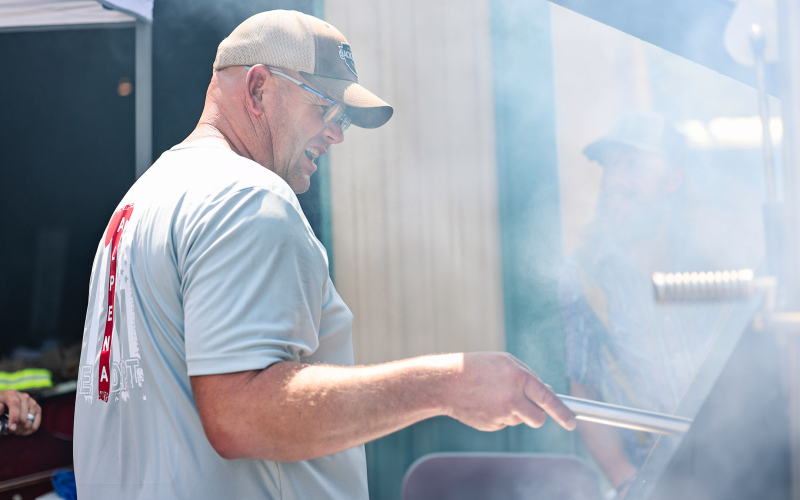 Eric Siemonsma and fellow Alpena Volunteer Fire Department members kept the grill busy serving the crowd.